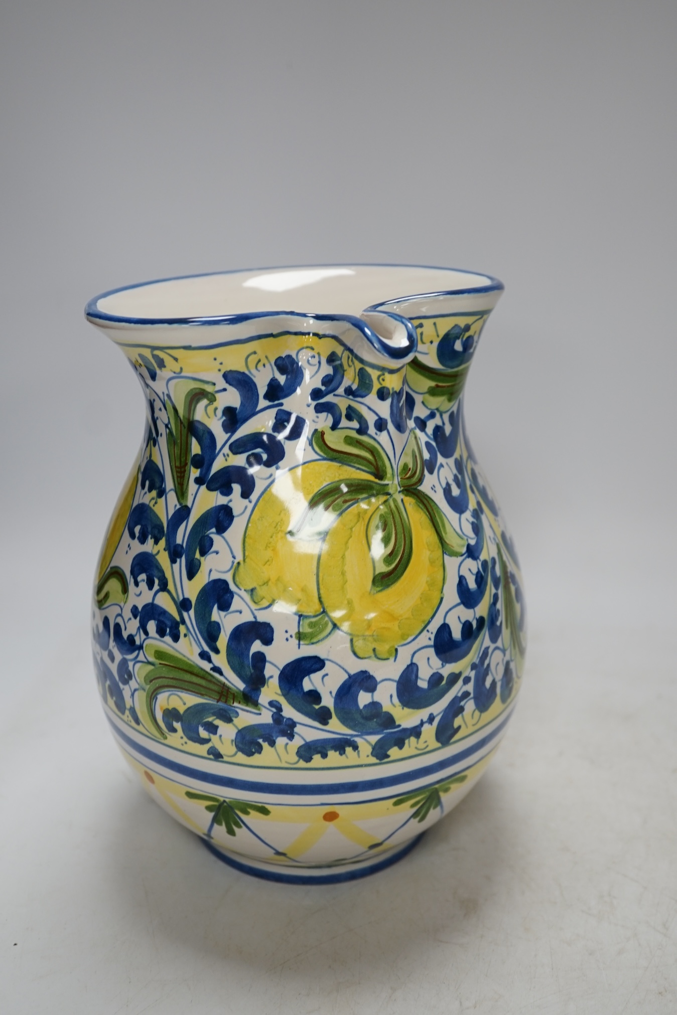From the Studio of Fred Cuming. An Italian maiolica ‘lemons’ jug, 20cm high. Condition - good